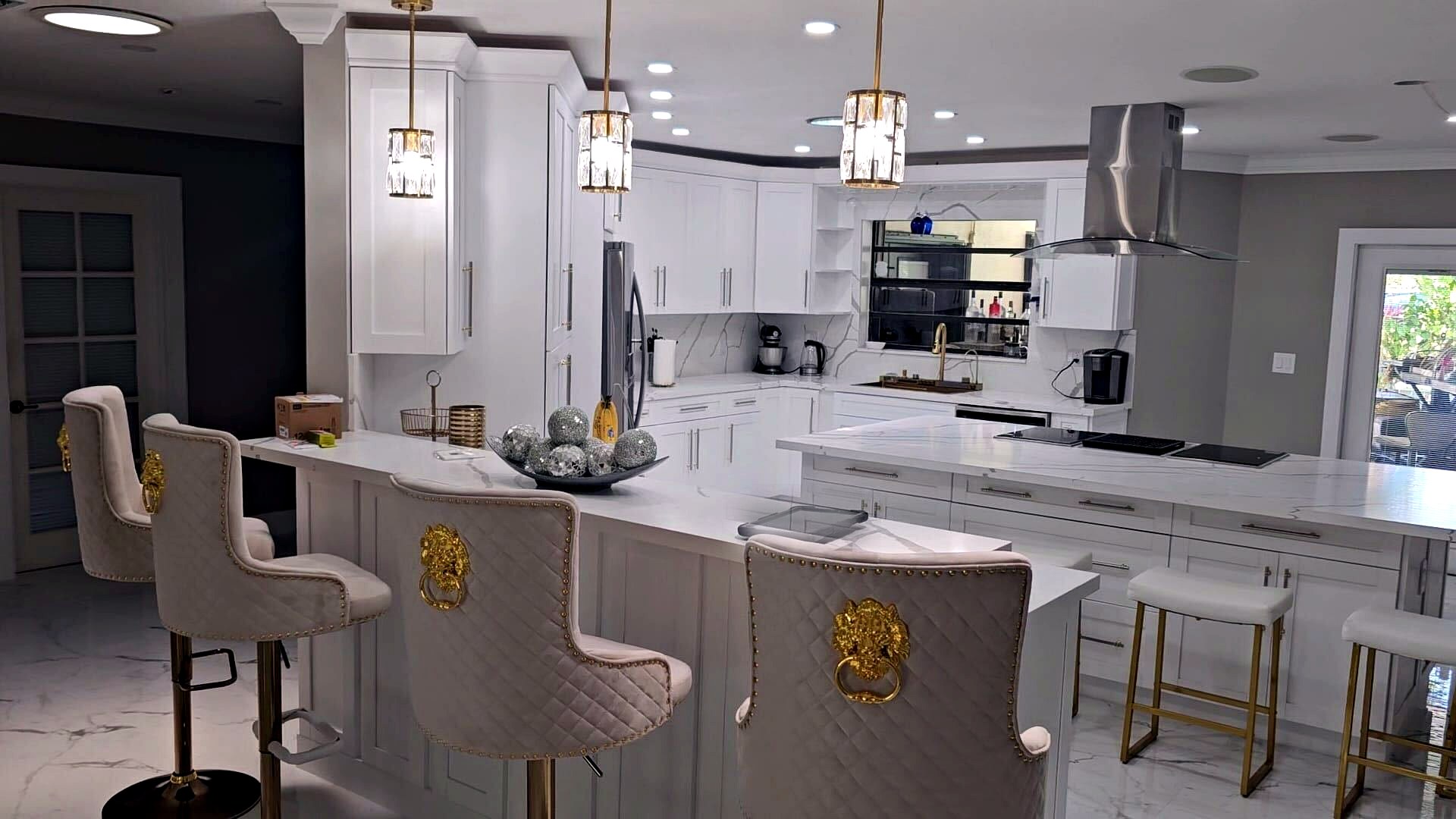 Luxury white kitchen remodel with marble island in Hallandale Beach