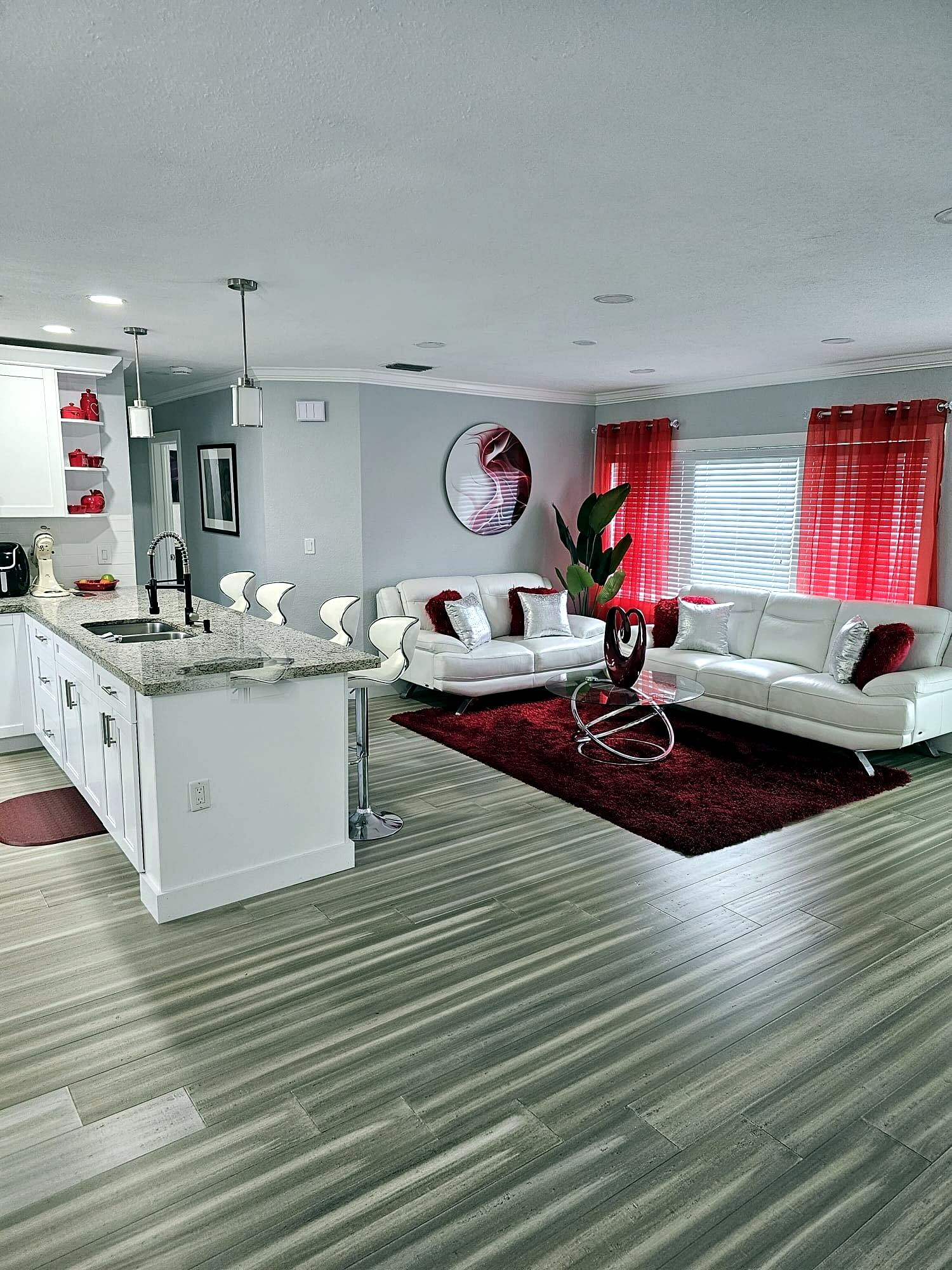 Open-concept living area with renovated kitchen